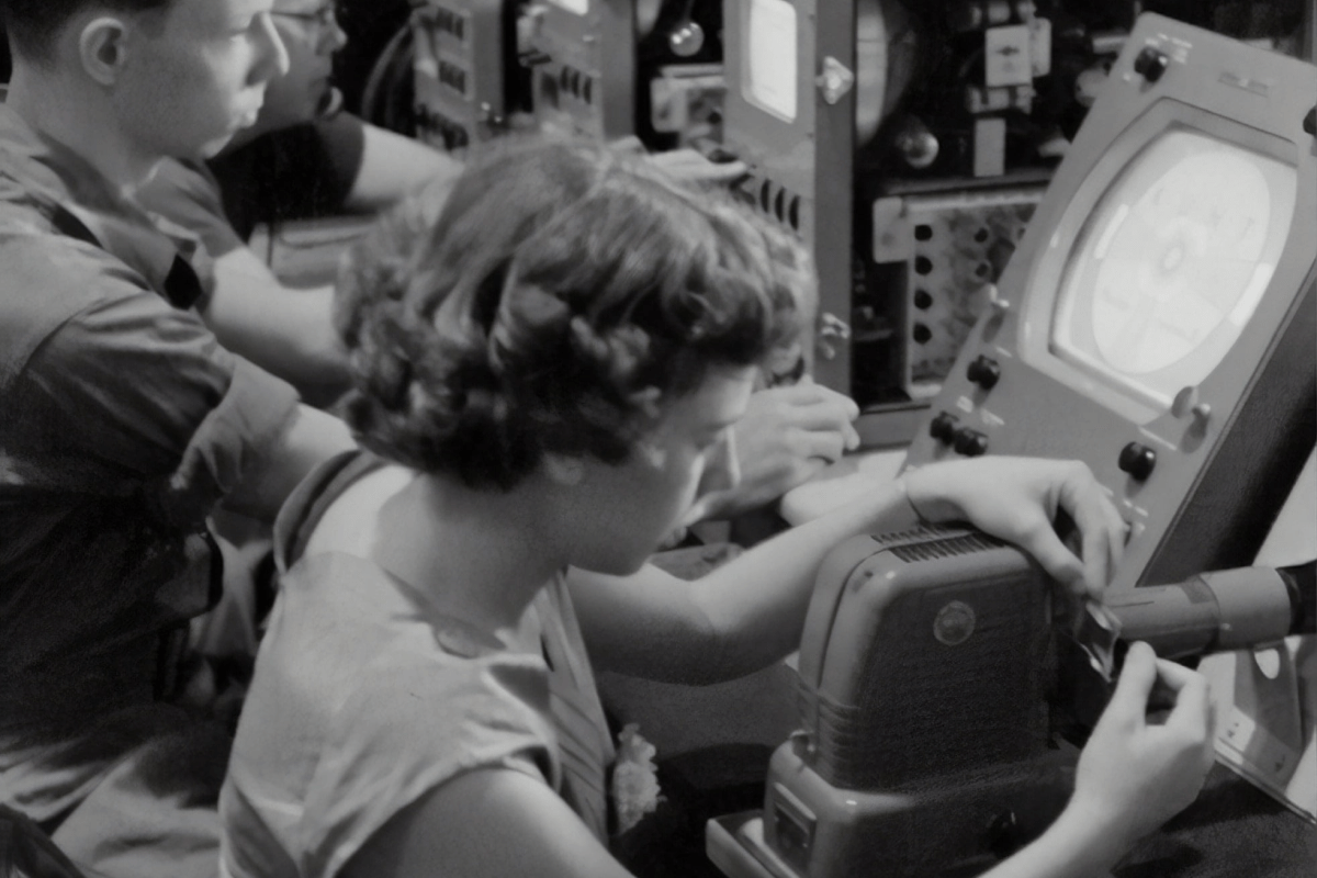 vintage photo of people working on monitors